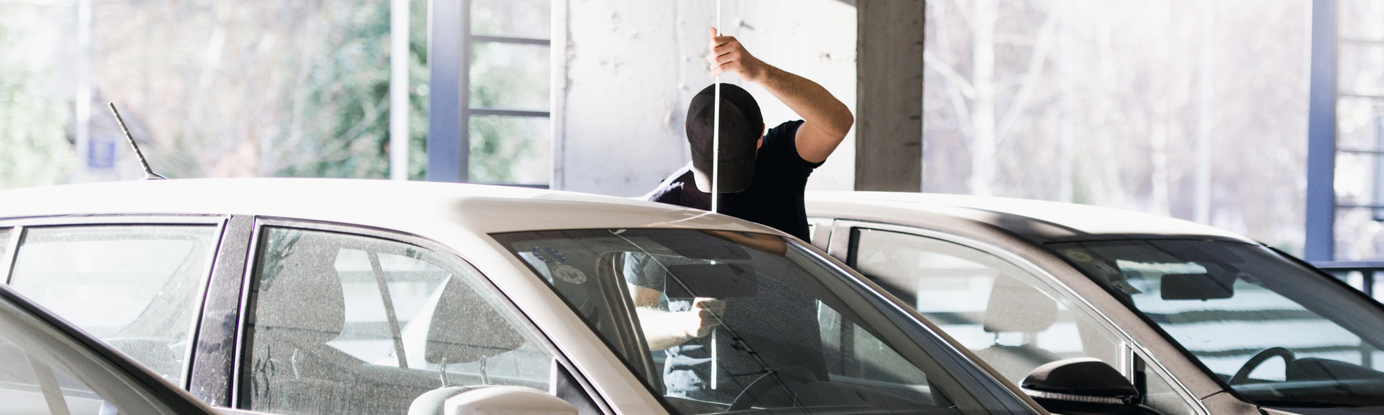 Person attempting to break into a parked car