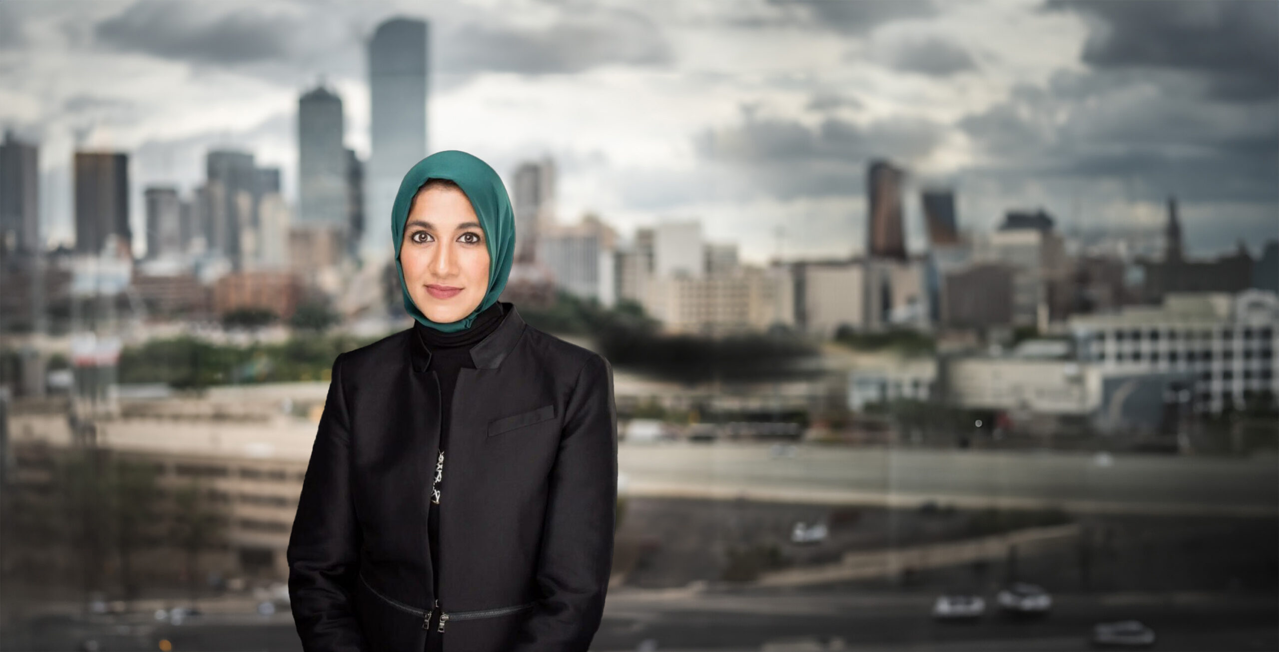 hero huma in front of dallas skyline scaled