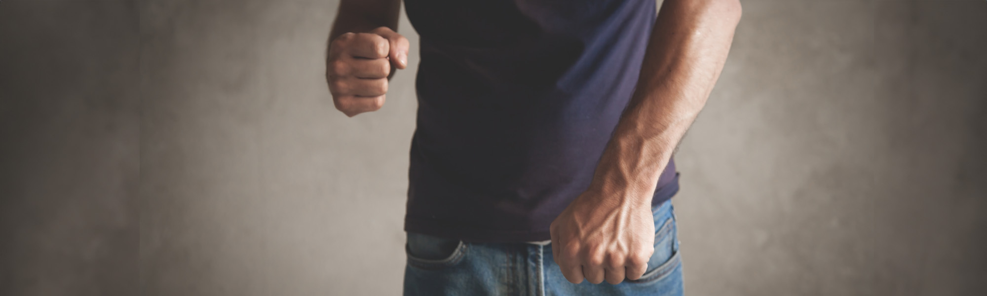 caucasian angry man threatening with fist