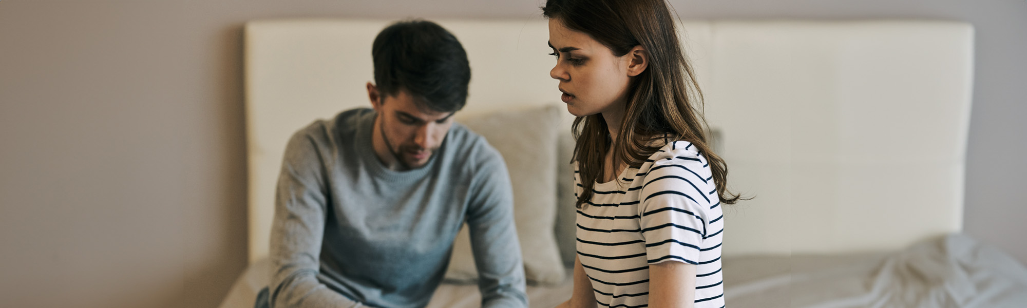 couple sleeping room communication conflict discontent