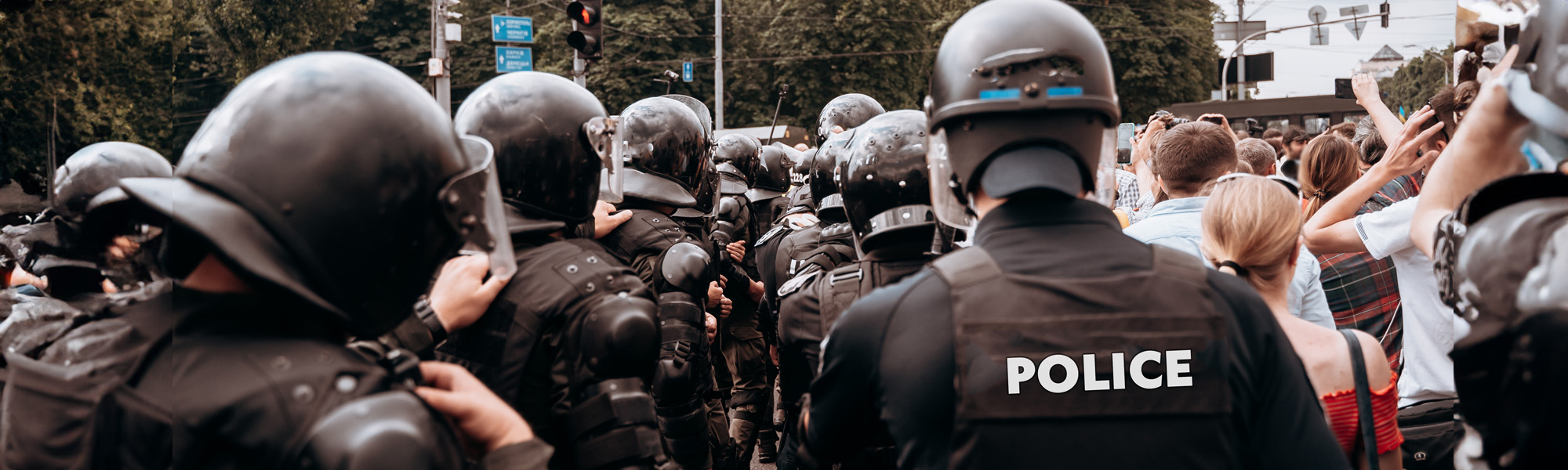 squad policemen are on alert along city street