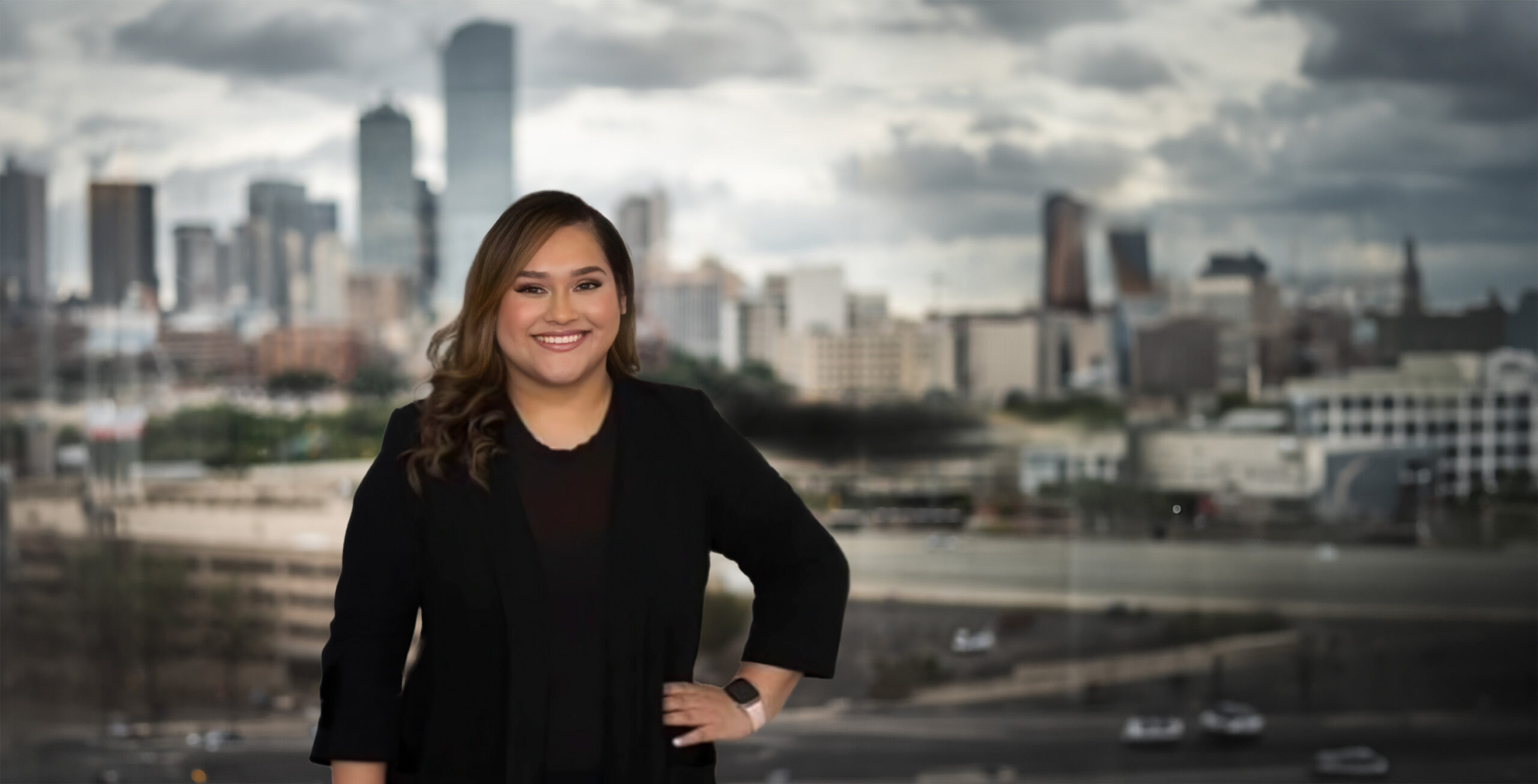 bio hero daisey in front of dallas skyline scaled