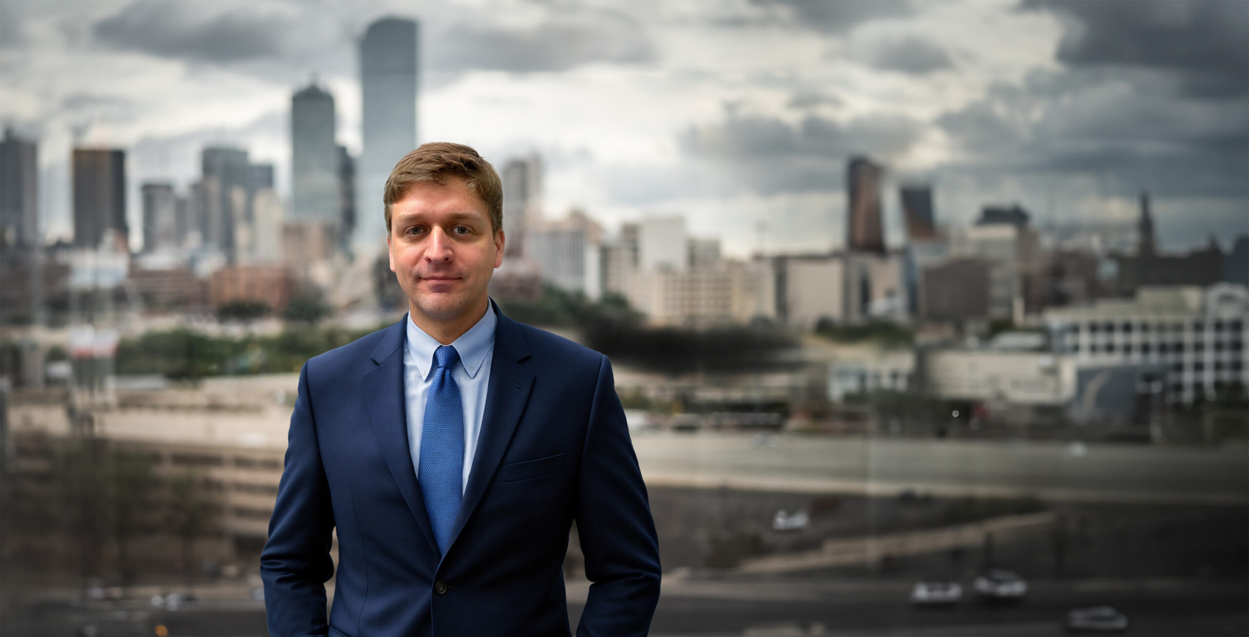 bio hero michael in front of dallas skyline scaled