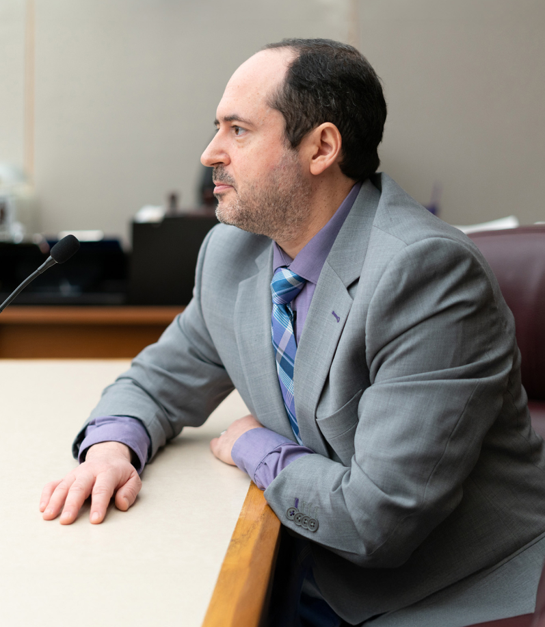 man sitting at desk side profile