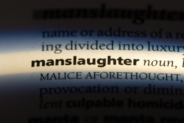manslaughter word in a dictionary. manslaughter concept.